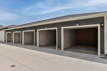 A row of garage doors in front of a building